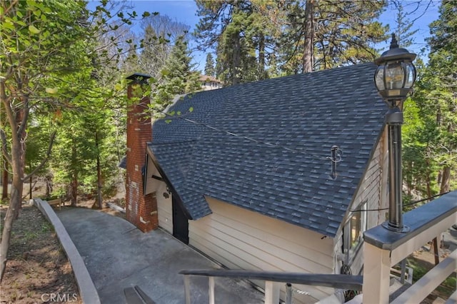 377 Hillside Rd, Lake Arrowhead, CA 92352 - exterior view of roof with shingles and a chimney
