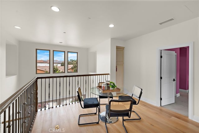 dining space featuring baseboards, recessed lighting, wood finished floors, and visible vents