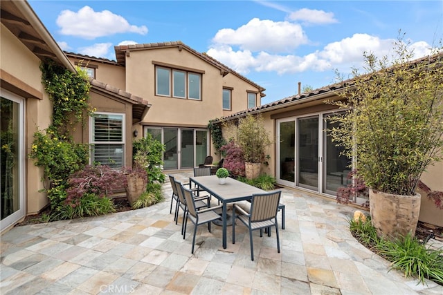 view of patio featuring outdoor dining area