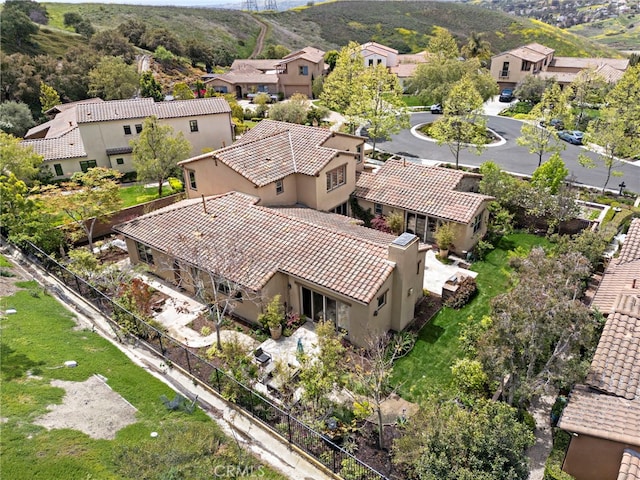 birds eye view of property with a residential view