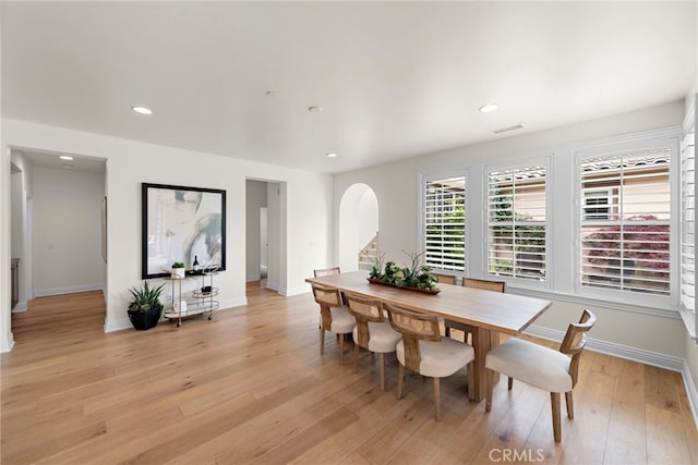 dining room featuring recessed lighting, baseboards, visible vents, and light wood finished floors