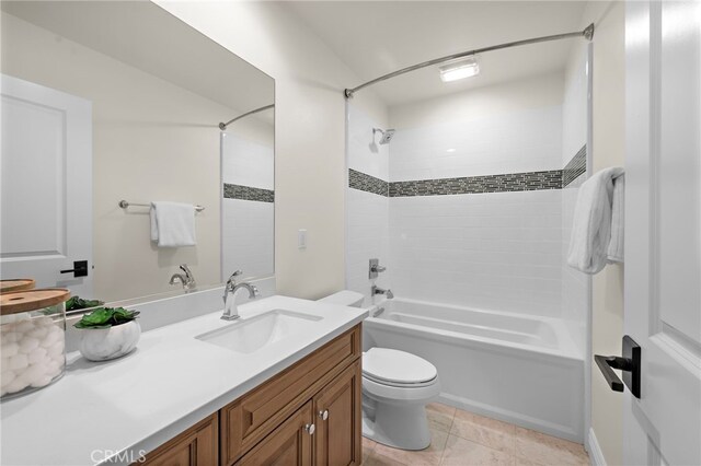 full bath featuring vanity, tile patterned flooring, toilet, and shower / washtub combination
