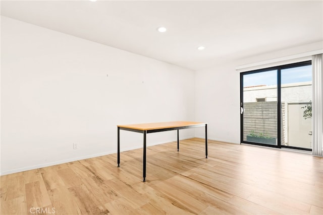 unfurnished room featuring recessed lighting, baseboards, and light wood-style flooring