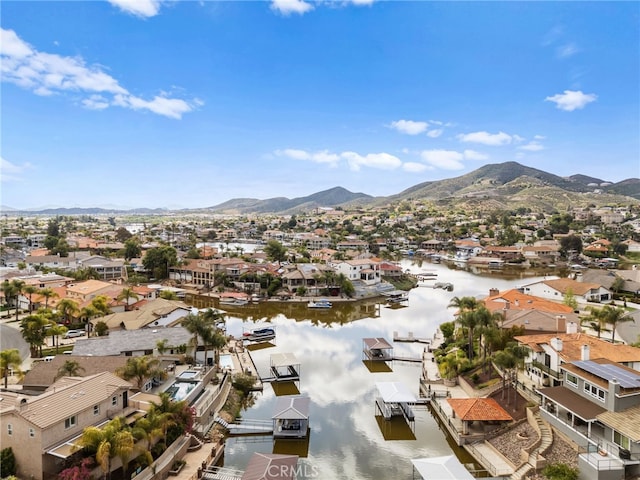 aerial view with a residential view and a water and mountain view