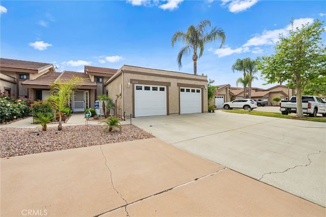 30156 Yellow Feather Dr, Canyon Lake, CA 92587 - view of front of property with stucco siding, concrete driveway, and an attached garage