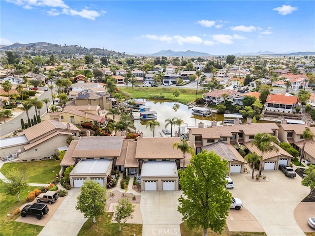 bird's eye view with a residential view and a water and mountain view