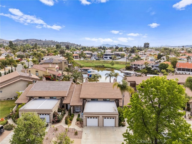 aerial view featuring a residential view and a water and mountain view