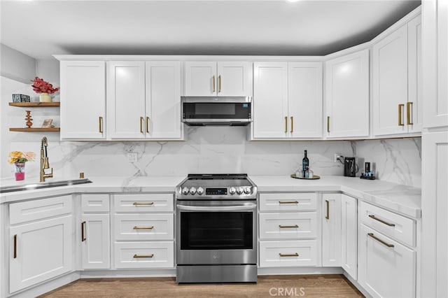 30156 Yellow Feather Dr, Canyon Lake, CA 92587 - kitchen featuring appliances with stainless steel finishes, a sink, white cabinetry, and decorative backsplash