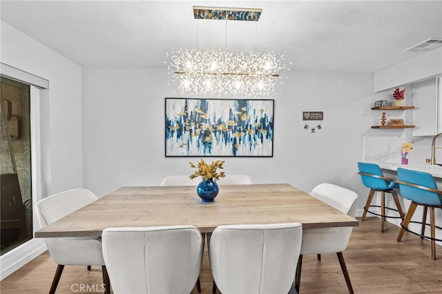 30156 Yellow Feather Dr, Canyon Lake, CA 92587 - dining space featuring wood finished floors and a chandelier