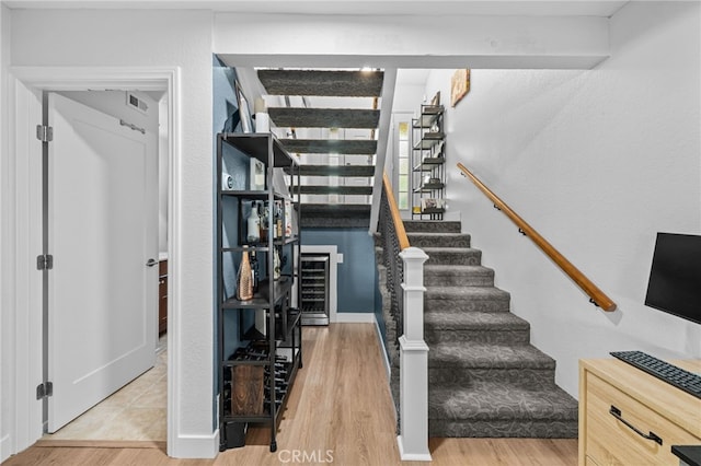 30156 Yellow Feather Dr, Canyon Lake, CA 92587 - stairway featuring wood finished floors and wine cooler
