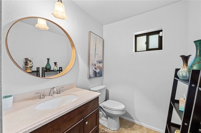 30156 Yellow Feather Dr, Canyon Lake, CA 92587 - bathroom with toilet, vanity, baseboards, a textured wall, and tile patterned floors