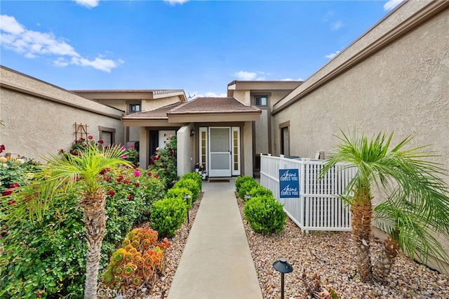 30156 Yellow Feather Dr, Canyon Lake, CA 92587 - entrance to property featuring stucco siding and fence