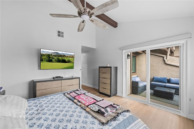 bedroom featuring ceiling fan, visible vents, access to exterior, light wood finished floors, and vaulted ceiling with beams