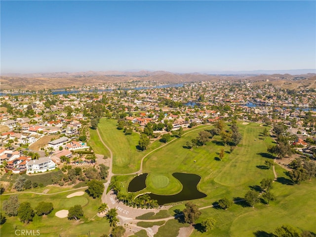 aerial view with a water and mountain view, view of golf course, and a residential view