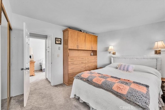 bedroom with light colored carpet