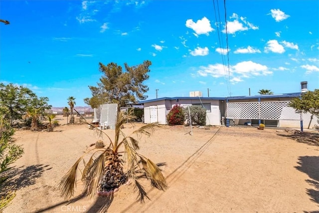 back of property with fence