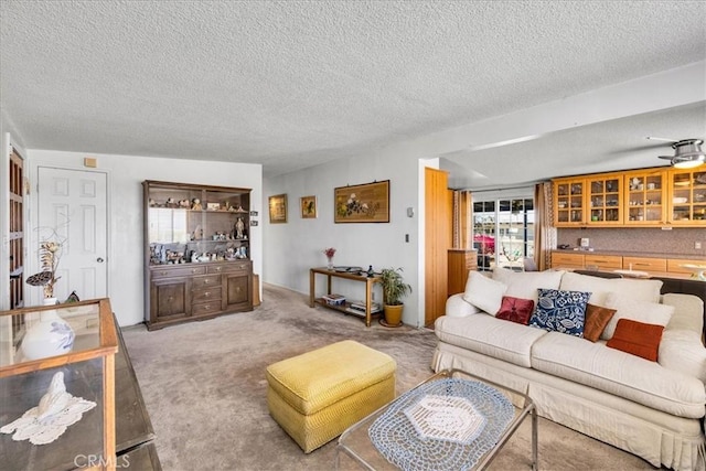 living room featuring a textured ceiling and light colored carpet