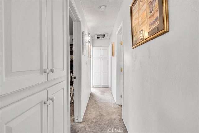 5304 Morongo Rd Unit 29, Palms, CA 92277 - hall with light carpet and a textured ceiling