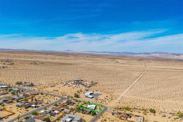 aerial view featuring a mountain view, a rural view, and a desert view