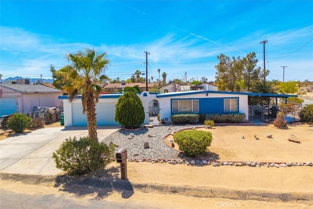 5304 Morongo Rd Unit 29, Palms, CA 92277 - view of front of home featuring driveway and a garage