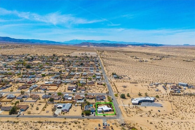 drone / aerial view with a mountain view, a rural view, and a desert view
