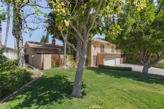 2173 Ranchwood Pl, Riverside, CA 92506 - view of yard with a balcony, driveway, and a garage