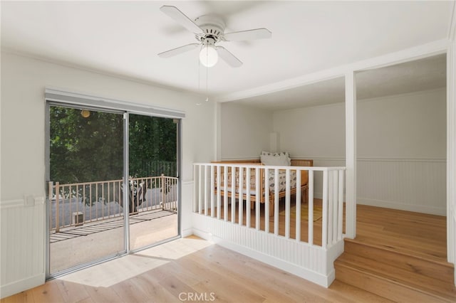 2173 Ranchwood Pl, Riverside, CA 92506 - spare room with wood finished floors, ceiling fan, and wainscoting