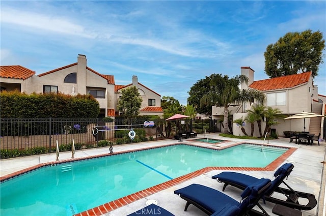 16059 Crete Ln, Huntington Beach, CA 92649 - pool with a patio, a hot tub, and fence