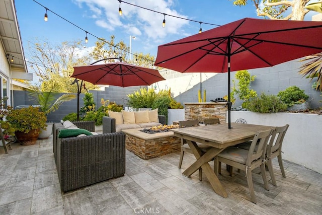 2176 N Pami Cir, Orange, CA 92867 - view of patio with outdoor dining area, a fenced backyard, and a fire pit