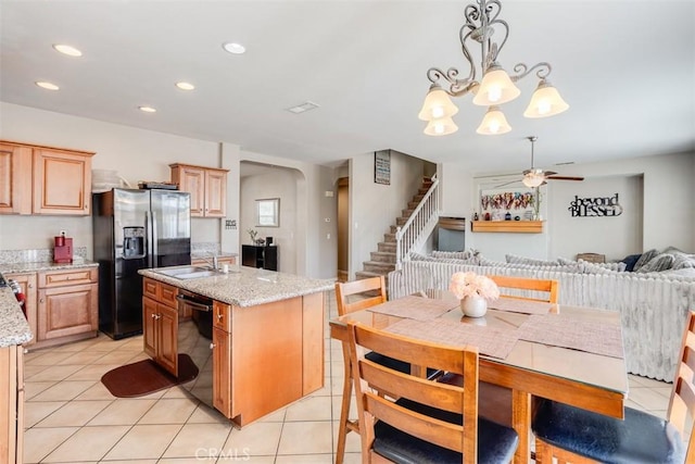 11947 Forest Park Ln, Victorville, CA 92392 - kitchen featuring arched walkways, dishwasher, fridge with ice dispenser, a kitchen island with sink, and ceiling fan with notable chandelier