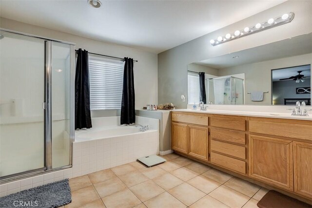 11947 Forest Park Ln, Victorville, CA 92392 - full bathroom featuring a sink, a stall shower, double vanity, a garden tub, and tile patterned flooring
