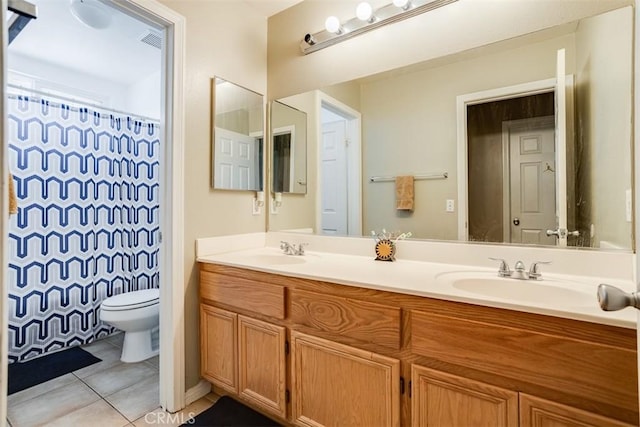 11947 Forest Park Ln, Victorville, CA 92392 - full bath featuring double vanity, toilet, tile patterned flooring, and a sink