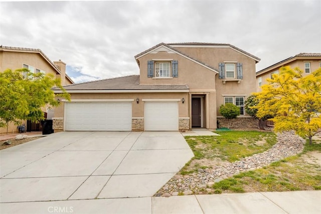 11947 Forest Park Ln, Victorville, CA 92392 - traditional-style house featuring driveway, a tile roof, stone siding, an attached garage, and stucco siding