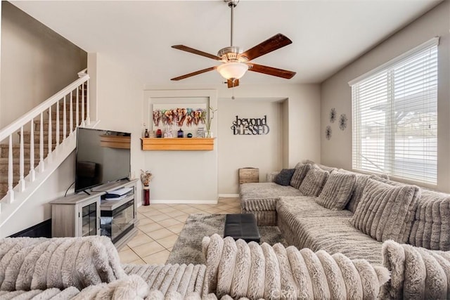 11947 Forest Park Ln, Victorville, CA 92392 - tiled living area featuring a ceiling fan, stairs, and baseboards