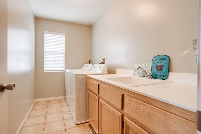 11947 Forest Park Ln, Victorville, CA 92392 - laundry area with light tile patterned floors, a sink, baseboards, separate washer and dryer, and cabinet space