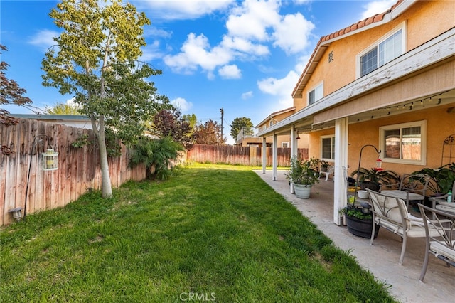 view of yard featuring a fenced backyard and a patio area