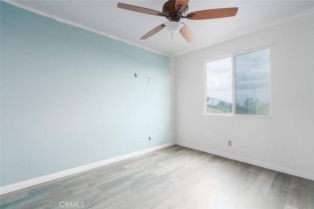 1059 Stowell Ranch Cir, Corona, CA 92881 - spare room featuring ceiling fan, light wood-style flooring, and baseboards