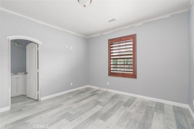 1059 Stowell Ranch Cir, Corona, CA 92881 - empty room with baseboards, light wood-type flooring, and crown molding