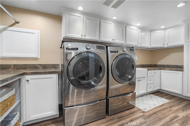 28852 Crestridge Rd, Rancho Palos Verdes, CA 90275 - washroom with cabinet space, washing machine and clothes dryer, wood finished floors, and recessed lighting