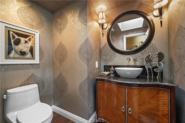 28852 Crestridge Rd, Rancho Palos Verdes, CA 90275 - bathroom with wood finished floors, vanity, toilet, and baseboards