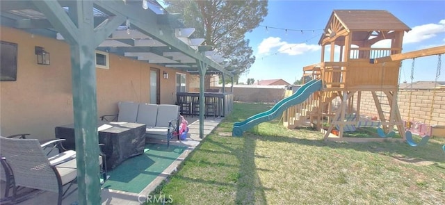 view of play area featuring a pergola, a patio area, a yard, a fenced backyard, and an outdoor hangout area