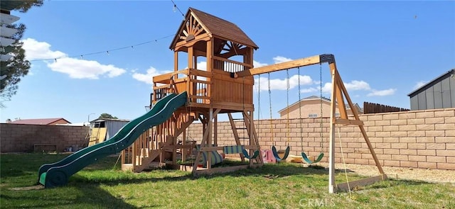 view of jungle gym with fence and a yard