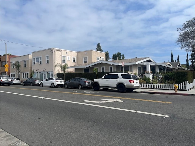 938 Stanley Ave, Long Beach, CA 90804 - view of parking with a residential view and fence