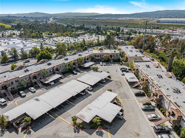 drone / aerial view featuring a mountain view