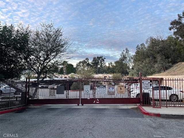 view of gate featuring fence