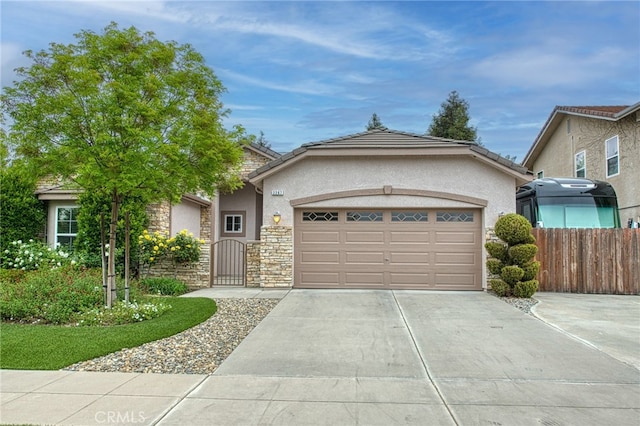 view of front of home with concrete driveway, stone siding, stucco siding, and a garage