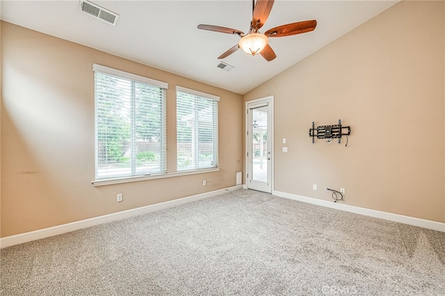 carpeted empty room featuring visible vents, ceiling fan, and baseboards