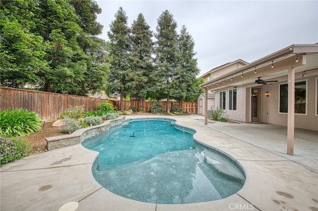 view of pool featuring a fenced in pool, a patio, ceiling fan, and a fenced backyard