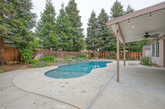 view of swimming pool featuring a ceiling fan, a fenced in pool, a fenced backyard, and a patio area