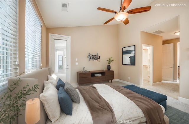 bedroom featuring baseboards, visible vents, and multiple windows